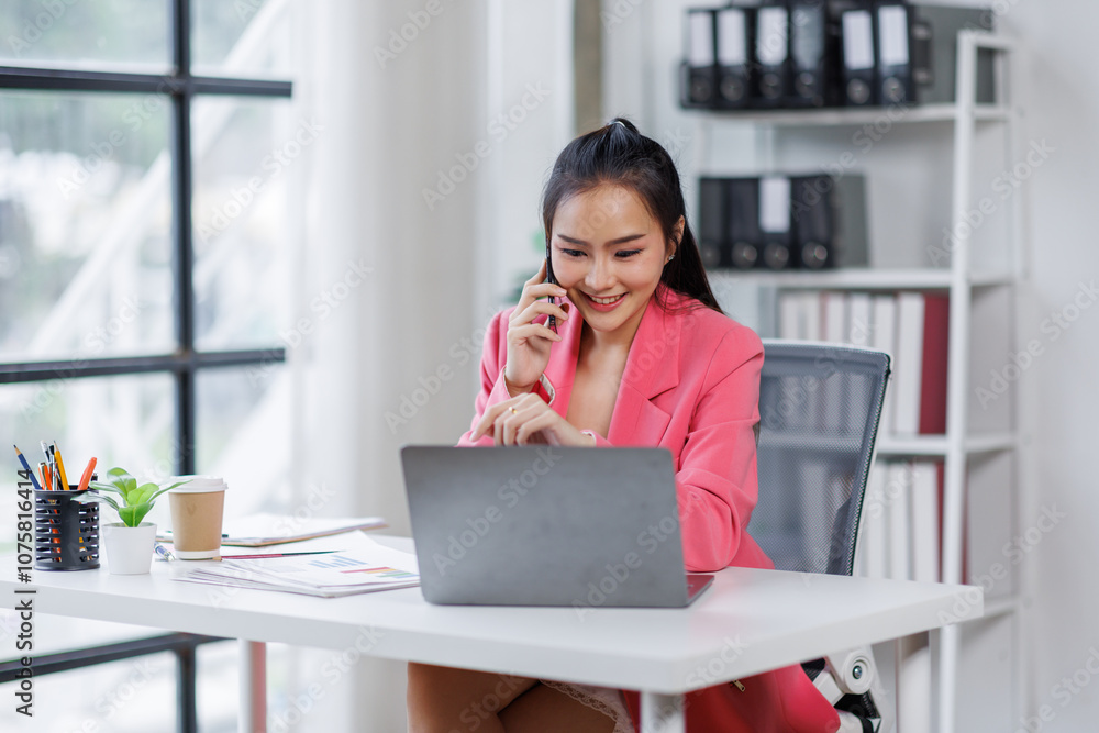 business asian woman with talking on mobile phone and work on documents and laptops for. Confident business woman working in the office workplace, business asian woman with talking on mobile phone and work on documents and laptops for. Confident business woman working in the office workplace,