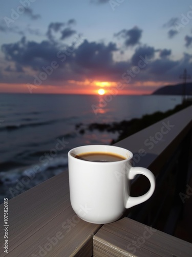 A cup of coffee on wooden railing at sunset over ocean, vacation, nature, dusk