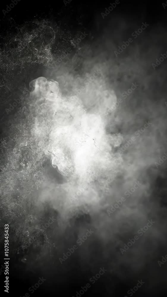 A close-up shot of a dense cloud of smoke, billowing upwards against a dark sky A close-up shot of a dense cloud of smoke, billowing upwards against a dark sky