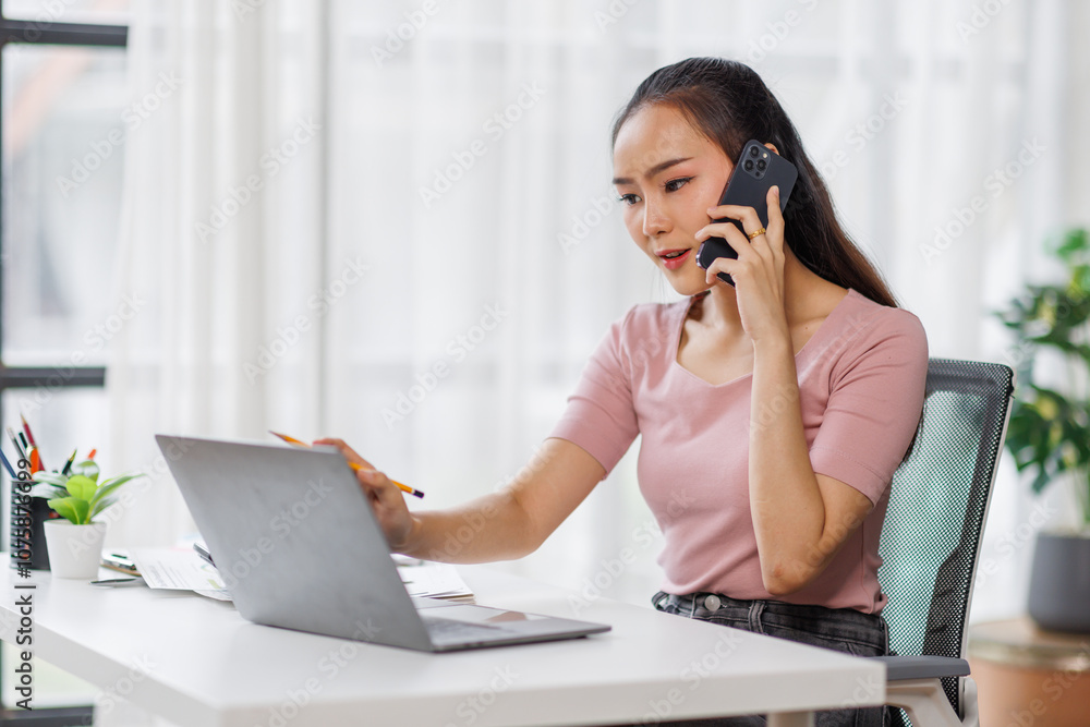 Cheerful business Asian woman freelancer making telephone call share good news about project working in office workplace, business finance concept. Cheerful business Asian woman freelancer making telephone call share good news about project working in office workplace, business finance concept.