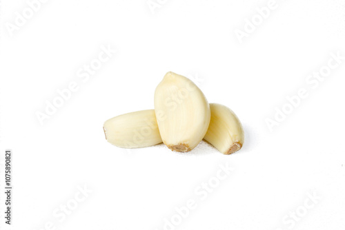 Peeled garlic cloves isolated on white background. Food ingredients