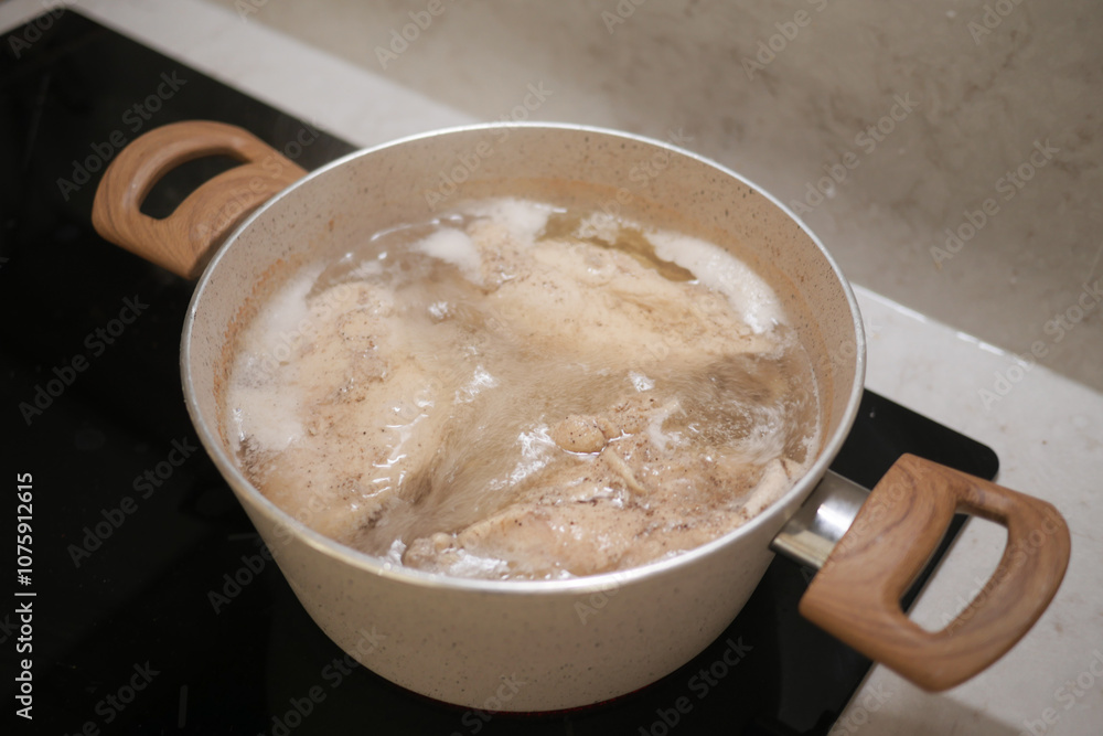 Boiling Chicken in a Pot for Cooking Delicious Homemade Meals with Nutritious Ingredients Boiling Chicken in a Pot for Cooking Delicious Homemade Meals with Nutritious Ingredients