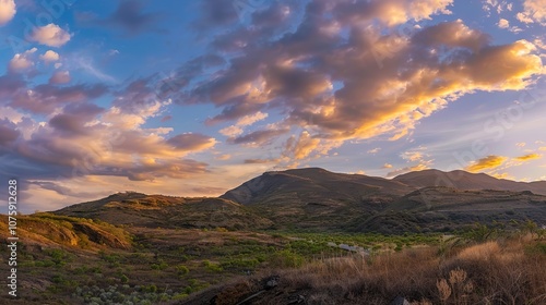 Asphalt_road_and_mountain_with_sky_clouds_