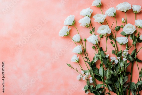 Elegant Arrangement of White Roses and Greenery on Soft Coral Background Capturing the Essence of Freshness and Natural Beauty Perfect for Backgrounds or Decoration