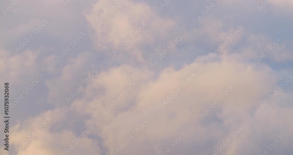 Clouds in shades of white and gray drift slowly across a vibrant blue sky, creating a serene and peaceful atmosphere. The scene captures the beauty of nature on a sunny day Clouds in shades of white and gray drift slowly across a vibrant blue sky, creating a serene and peaceful atmosphere. The scene captures the beauty of nature on a sunny day