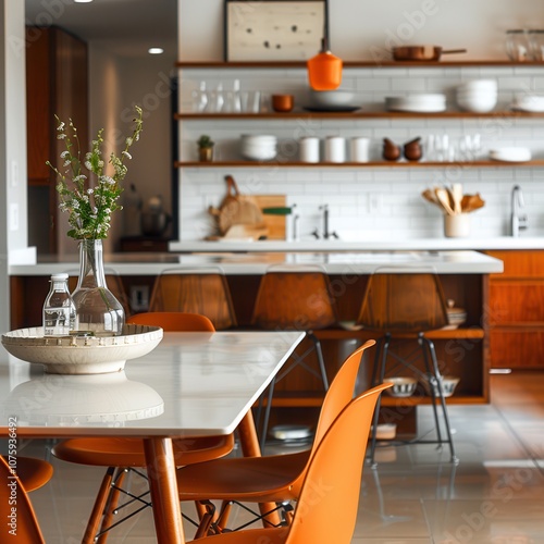 A modern kitchen with a bright dining area, featuring elegant furniture, decorative items, and a clean, minimalist design.