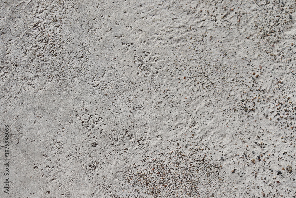 Fototapeta premium Abstract, textured background. A closeup of cement and asphalt for the construction. Material and stone for sidewalk or street construction.
