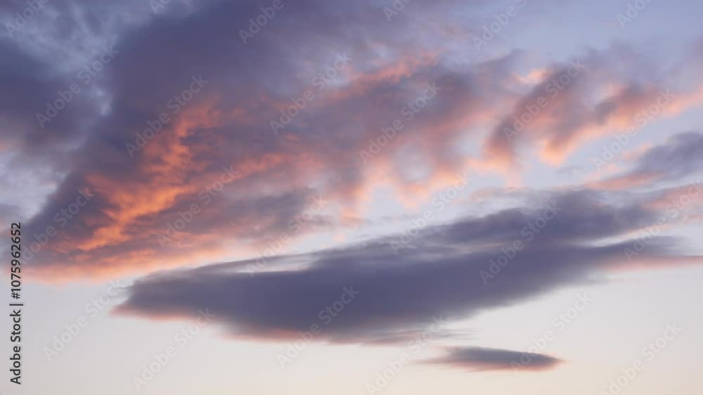 A Serene Sunset Showcasing Clouds Bathed in Soft Pastel Hues Over a Clear Sky Above A Serene Sunset Showcasing Clouds Bathed in Soft Pastel Hues Over a Clear Sky Above
