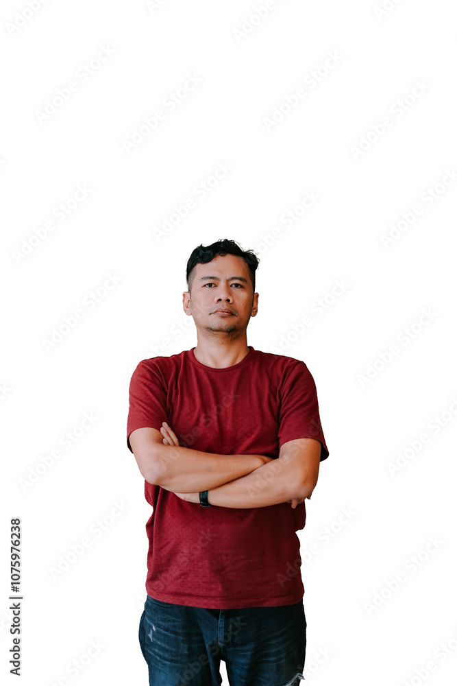 A man in a red T-shirt and jeans sits confidently with arms crossed A man in a red T-shirt and jeans sits confidently with arms crossed
