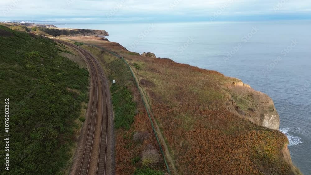 Rising drone of North East Coast railway line showing sea stack. Easington - County Durham, UK Rising drone of North East Coast railway line showing sea stack. Easington - County Durham, UK