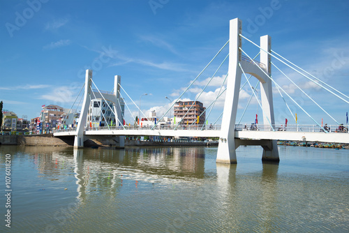 Modern cable-stayed bridge over the river Tu Sa on a sunny day. Phan Thiet, Vietnam photo