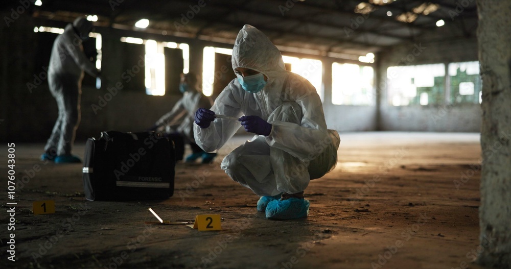 Crime, people and forensics at scene with sample, evidence and DNA swab with clue in abandoned warehouse. CSI team, hazmat suit or investigation in building for legal service, inspection or pathology Crime, people and forensics at scene with sample, evidence and DNA swab with clue in abandoned warehouse. CSI team, hazmat suit or investigation in building for legal service, inspection or pathology
