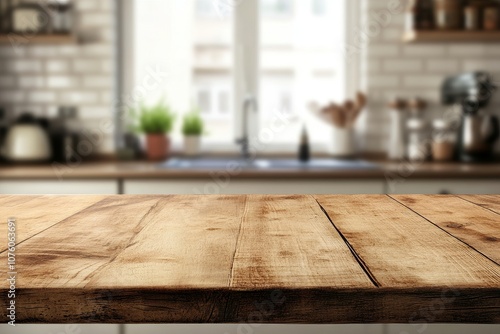 Close up of a rustic wooden table top with a blurry kitchen background.