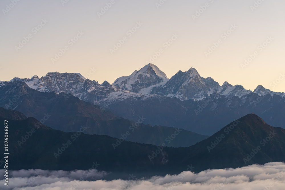 Beautiful mountainscape scape ho Himalayas with clouds and morning sun rays Beautiful mountainscape scape ho Himalayas with clouds and morning sun rays
