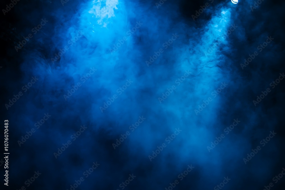 Fototapeta premium Blue Stage Lights Shining In Darkened Environment.