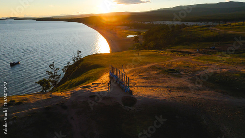 flying over Shamanka rock on Olkhon island on Lake Baikal photo