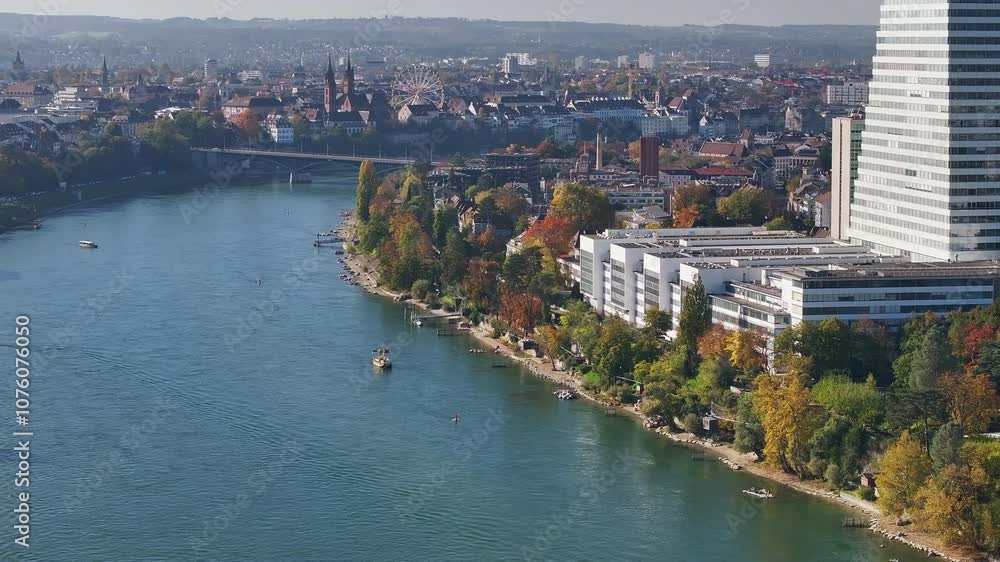 Basel's rhine promenade in autumn with cityscape and colorful foliage, aerial view Basel's rhine promenade in autumn with cityscape and colorful foliage, aerial view