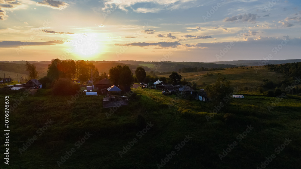 orange dawn in the countryside in one of the Siberian villages orange dawn in the countryside in one of the Siberian villages