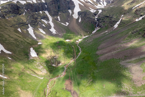 Aerial view of Gagharot waterwall and river on sunny spring day. Mount Aragats, Armenia. photo