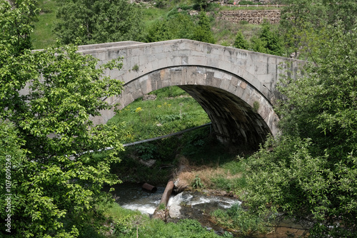 Typical medieval armenian bridge on a sunny spring day. Yaghdan village, Armenia. photo