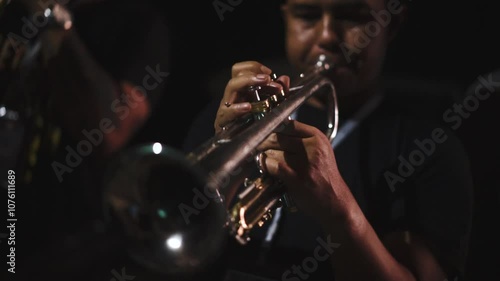 Cinematic Close Up Musician focus on playing trumpet at the night music concert festival