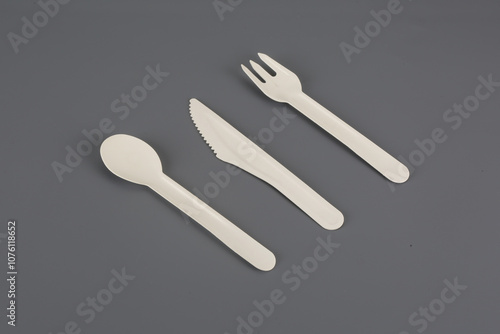 Natural eco-friendly disposable utensils (fork, spoon, dish plate, bowl, cup and fast food box container) made of fiber of bagasse and bamboo on wooden Save the earth photo