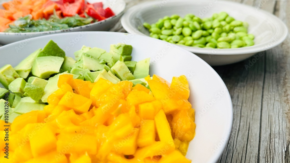 Cut fruits and vegetables together with rice. Vegetarian poke bowl preparation. Cut fruits and vegetables together with rice. Vegetarian poke bowl preparation.