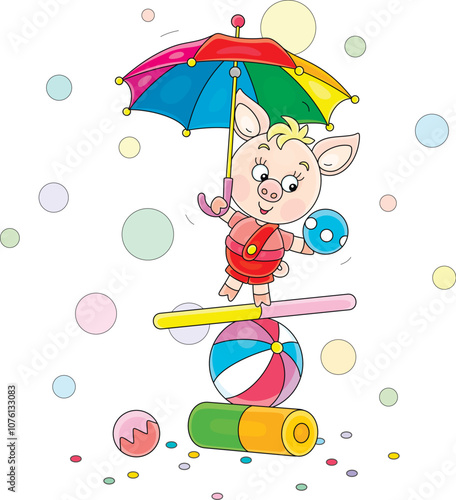 Funny little piglet equilibrist with a toy umbrella and a ball balancing on a colorful striped ball, board and cylinder in a fun circus performance, vector cartoon illustration on a white background