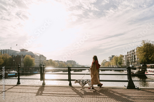 Canvas Print Portrait of a beautiful woman with dalmatian dog in Amsterdam