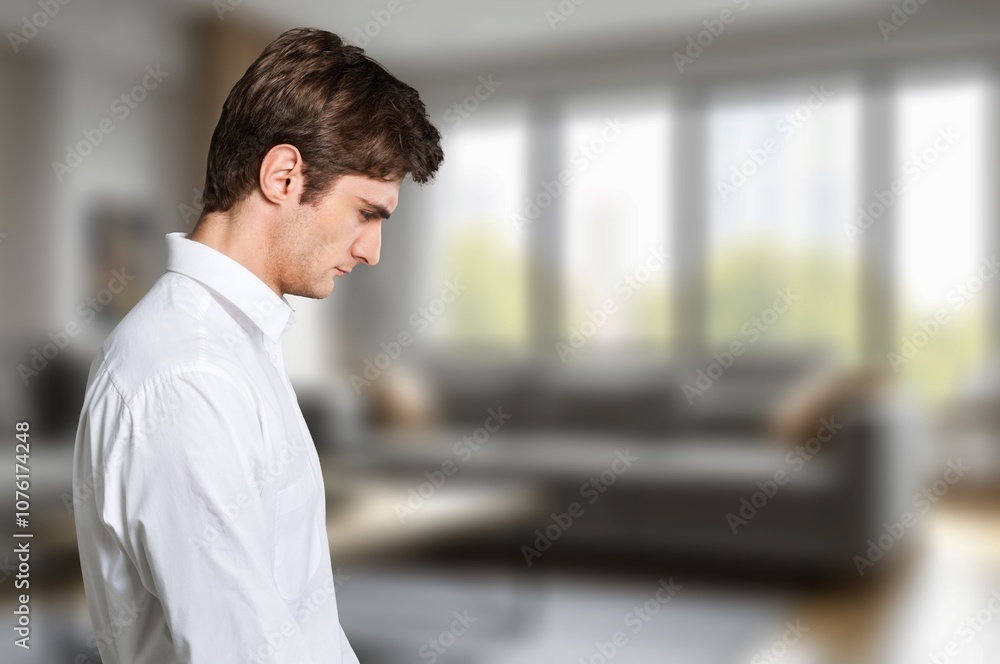 Stressed sad man sitting at home Stressed sad man sitting at home