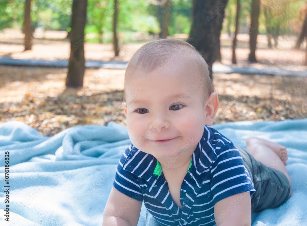 Smiling baby crawling in a park. About 8 months. Smiling baby crawling in a park. About 8 months.