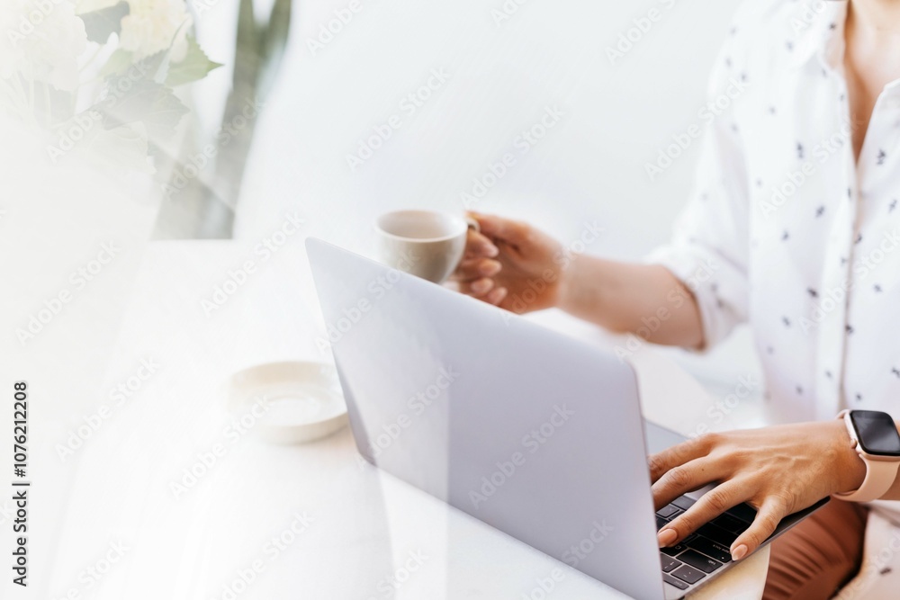 Businesswoman drinking coffee while working at home Businesswoman drinking coffee while working at home