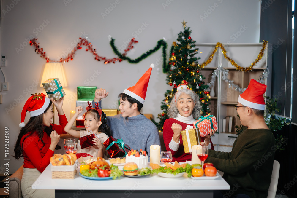 Joyful Asian family gathered for a Christmas feast, exchanging gifts, and celebrating the holiday season with love Joyful Asian family gathered for a Christmas feast, exchanging gifts, and celebrating the holiday season with love