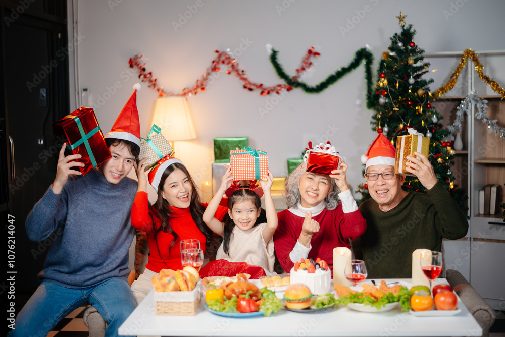 Joyful Asian family celebrating Christmas together with gifts, festive food, and decorations, capturing love, Joyful Asian family celebrating Christmas together with gifts, festive food, and decorations, capturing love,