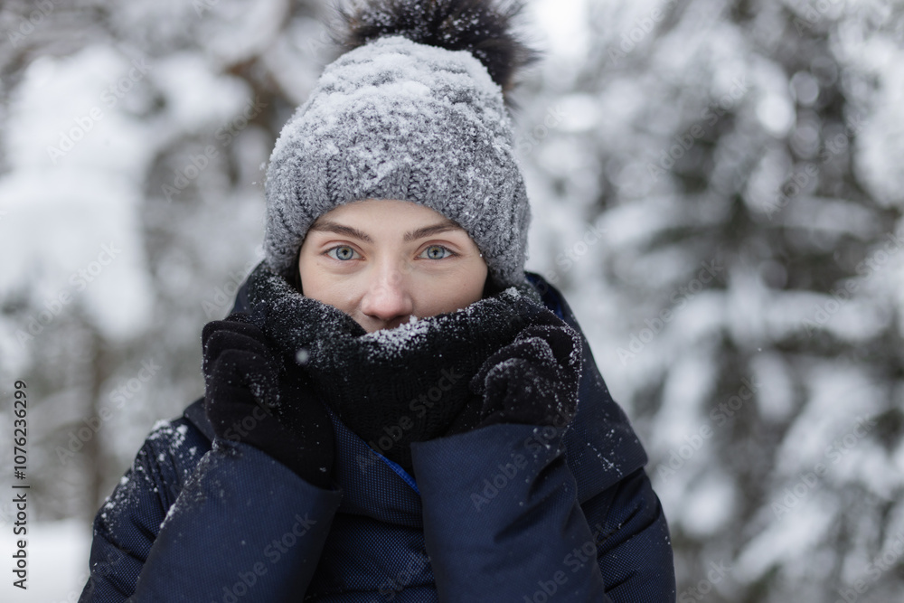 Portrait of a young adult woman in snowy forest Portrait of a young adult woman in snowy forest