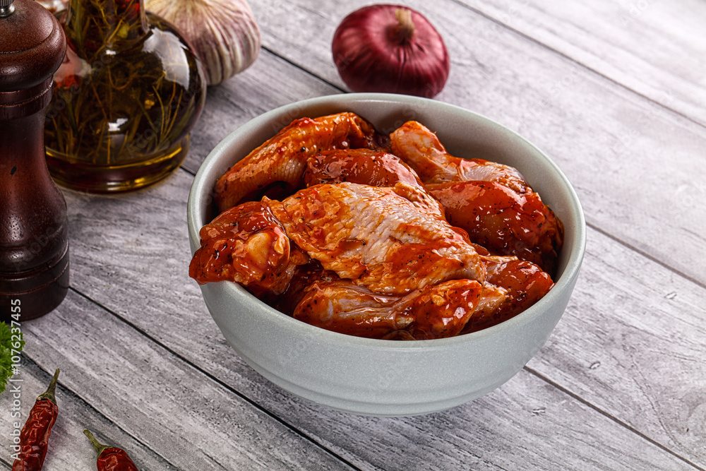 Raw marinated buffalo chicken wings Raw marinated buffalo chicken wings