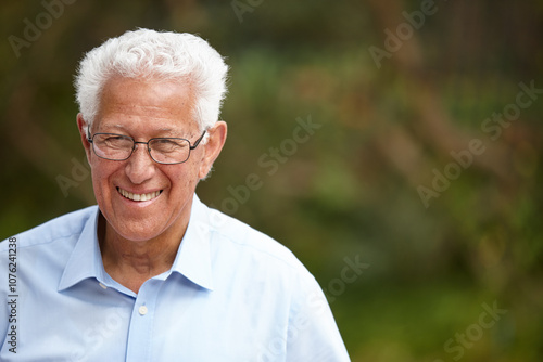 Senior man, portrait and smile outdoor at nursing home for retirement and pension plan in Germany. Male person, old age house and relax for care, support and wellness with resting or chill in garden