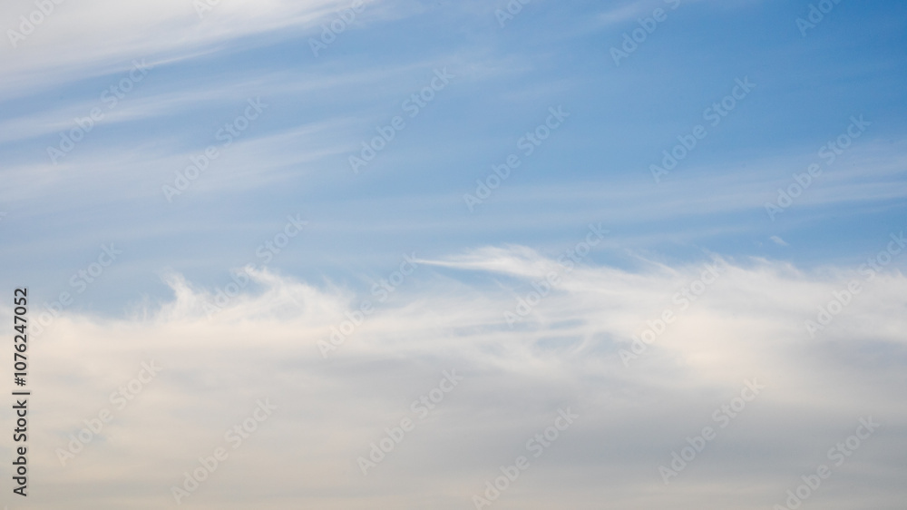 Serene blue sky with wispy white clouds, symbolizing tranquility and freedom, perfect for stress relief or mindfulness concepts Serene blue sky with wispy white clouds, symbolizing tranquility and freedom, perfect for stress relief or mindfulness concepts