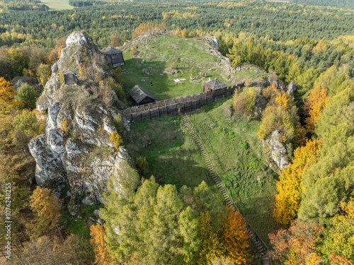 Aerial drone view of stronghold on Birow Hill. Reconstructed stronghold on Birow Hill in the Czestochowa Upland in the village of Podzamcze,Ogrodzieniec, Poland. Limestone rock hill in autumn. photo