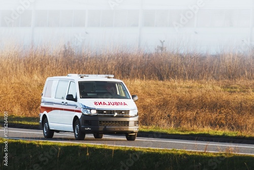 Professional paramedic team on the move in emergency vehicle