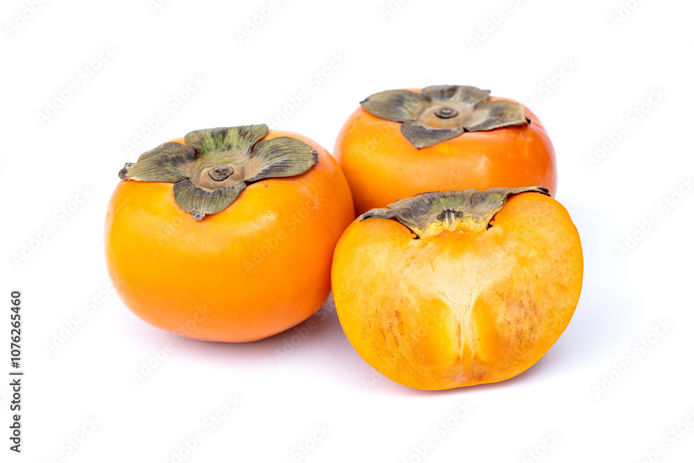 Sweet and crunchy ripe Persimmon Cut in half isolated on white background. Sweet and crunchy ripe Persimmon Cut in half isolated on white background.
