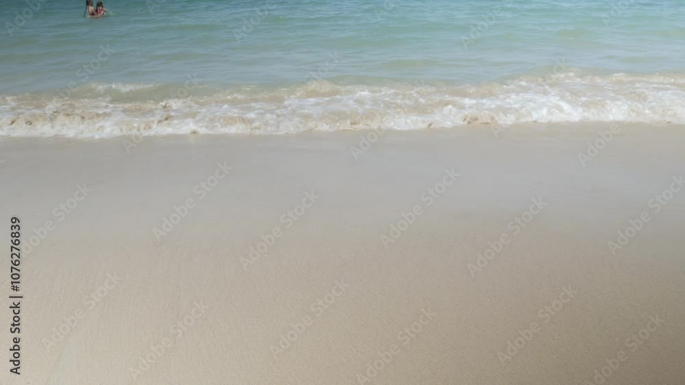 natural landscape over the sea beach surface in sunny afternoon time with sea wave hits white sand beach.Waves is crashing on the smooth white sand beach natural view. natural landscape over the sea beach surface in sunny afternoon time with sea wave hits white sand beach.Waves is crashing on the smooth white sand beach natural view.