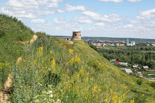 The tower of an ancient Bulgarian fortress on a high cliff on the banks of the Kama River, Elabuga, Tatarstan, Russian Federation photo