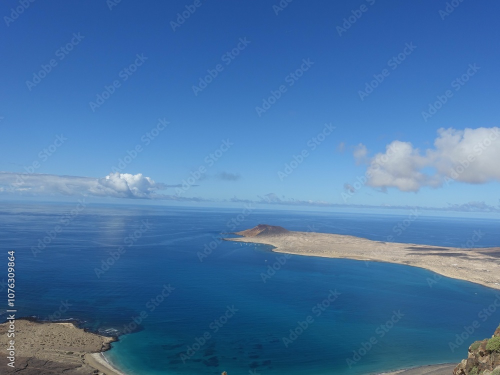 Aerial view of La Graciosa island with clear blue skies. Aerial view of La Graciosa island with clear blue skies.