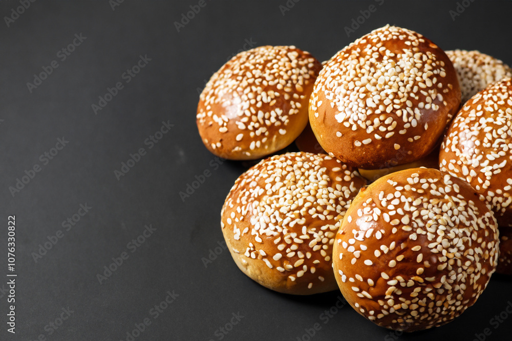 Bun with sesame seeds and small piece of yogurt lies on white. buns concept. white bun with sesame seeds and a small piece of yogurt lies on a white. a burger with sesame seeds and sprinkled yogurt. Bun with sesame seeds and small piece of yogurt lies on white. buns concept. white bun with sesame seeds and a small piece of yogurt lies on a white. a burger with sesame seeds and sprinkled yogurt.
