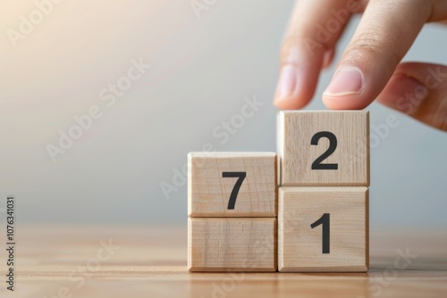 Wallpaper Mural A hand carefully places wooden cubes to signify the countdown from 2020 to 2021, symbolizing hope and new beginnings as the new year approaches. Torontodigital.ca