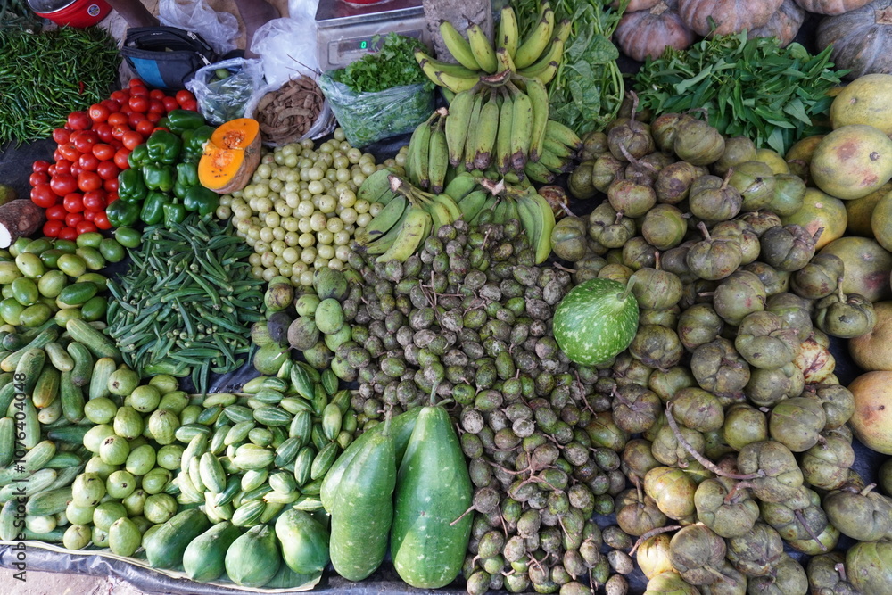 Variety of vegetables in the vegetable store like raw bananas, amlas, bottle gourd, pointed gourd, pumpkins and many others Variety of vegetables in the vegetable store like raw bananas, amlas, bottle gourd, pointed gourd, pumpkins and many others