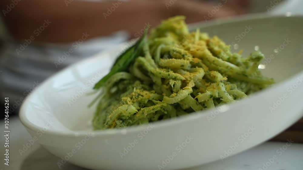 Zucchini pasta on a bowl in kitchen. Zucchini pasta on a bowl in kitchen.