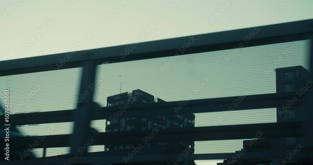 custom made wallpaper toronto digitalPanning shot from outside car, bus or train window or bicycle on high-rise office corporate buildings in modern neighbourhood in barcode, bjorvika in Oslo, Norway on a moody grey winter day