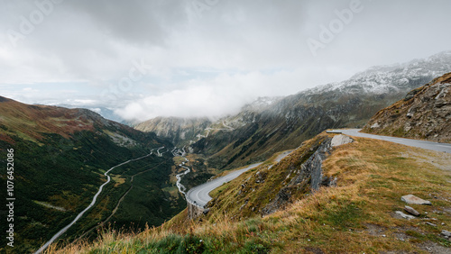 Furka pass on cloudy autumn morning. Landscape in Swiss alps - view from Furka mountain road. Winding road in Valais with lots of hairpins and turns. photo